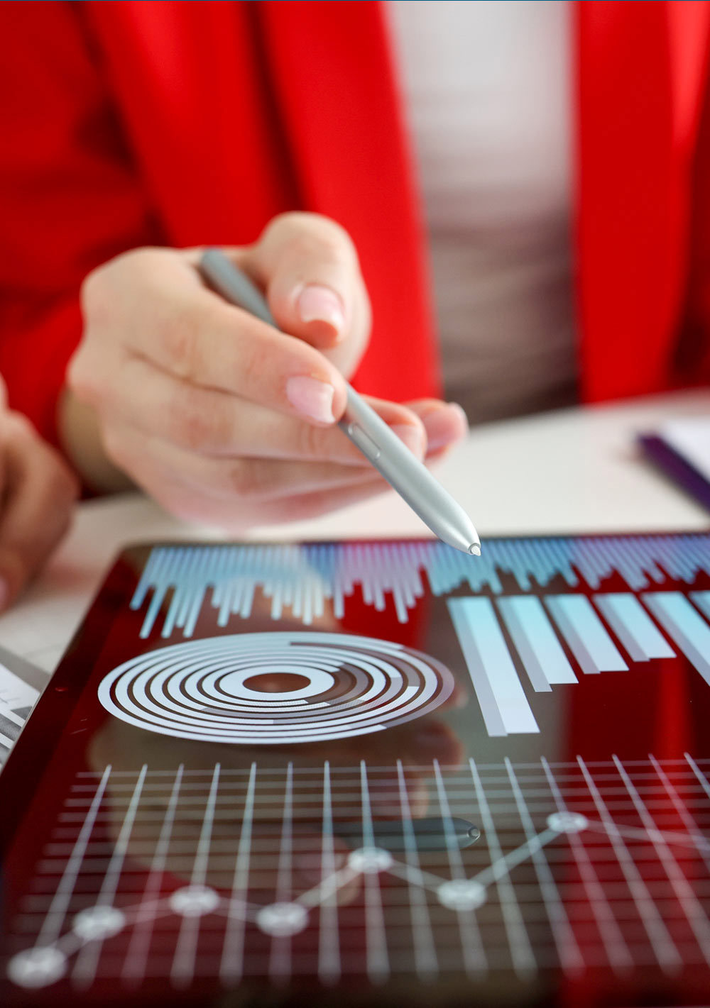 Business women studying charts and diagrams on digital tablet closeup. Business meetings concept.