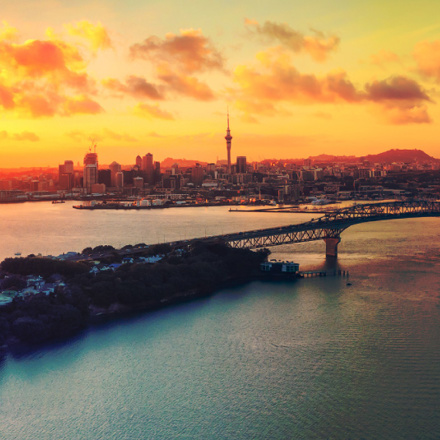 Auckland Harbour bridge and skyline at sunset