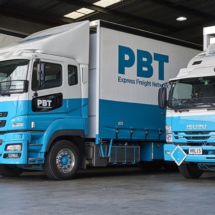 PBT trucks in their warehouse. 