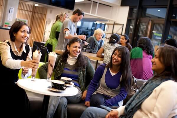 Students socialising in a canteen.