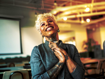 Businesswoman applauding at business meeting