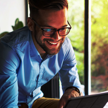 Young man holding digital tablet.