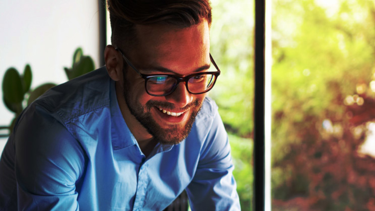 Young man holding digital tablet.