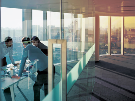 Business men having a meeting in an empty office space