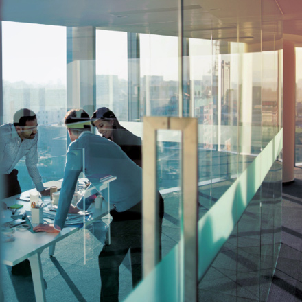 Business men having a meeting in an empty office space