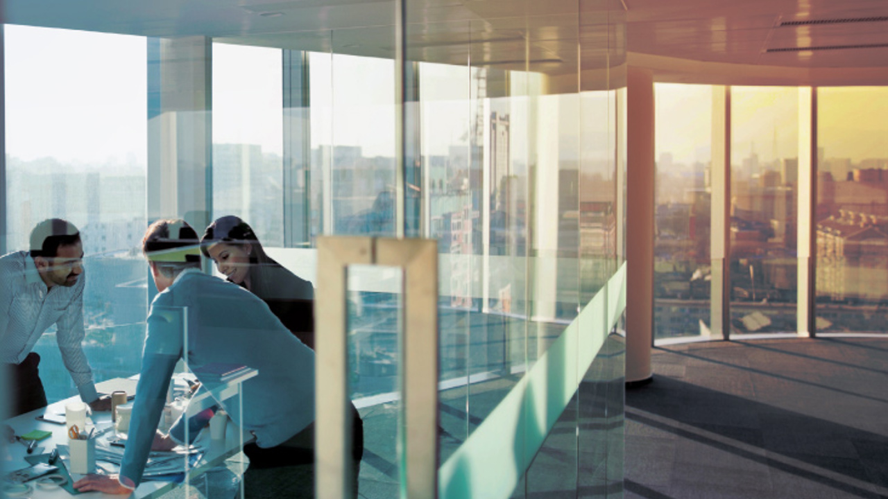 Business men having a meeting in an empty office space