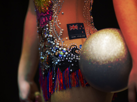 Macro image of NZ rhythmic gymnast holding a silver ball.