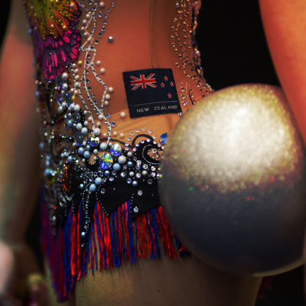 Macro image of NZ rhythmic gymnast holding a silver ball.