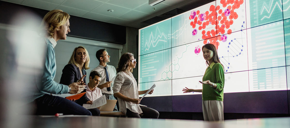 Meeting in Front of a Large Display Screen