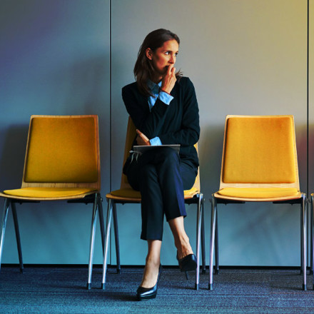 Stressful young woman waiting for job interview.