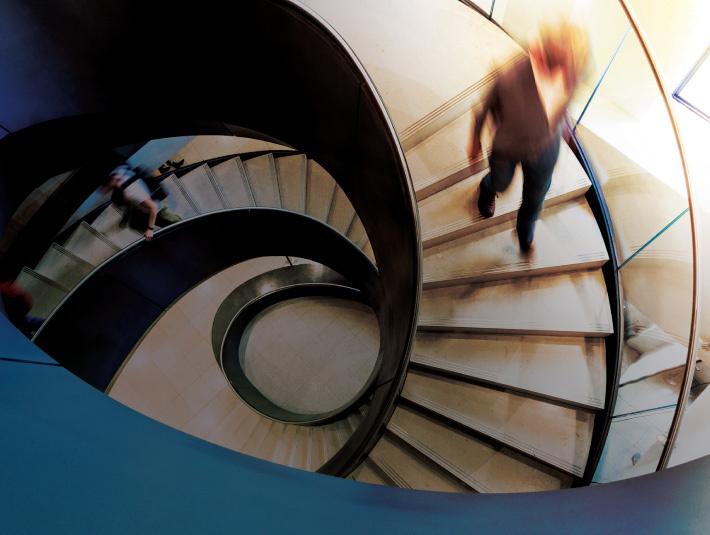 Person walking down office stairs.