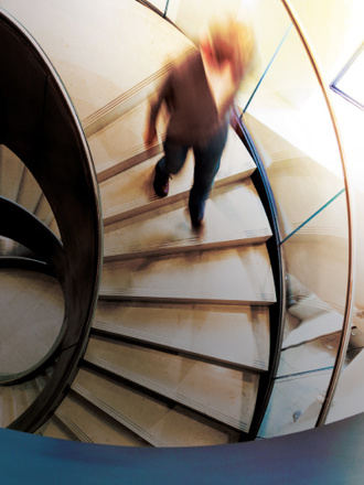 Person walking down office stairs.