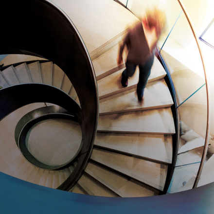 Person walking down office stairs.