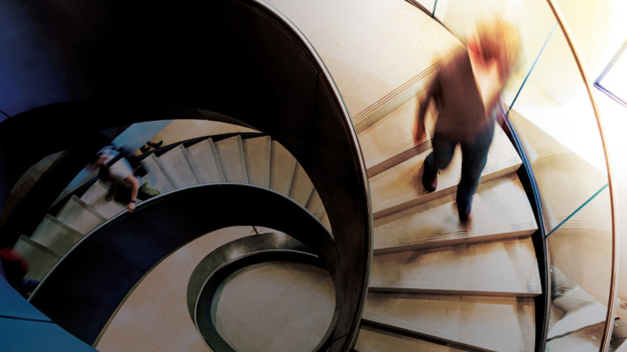 Person walking down office stairs.