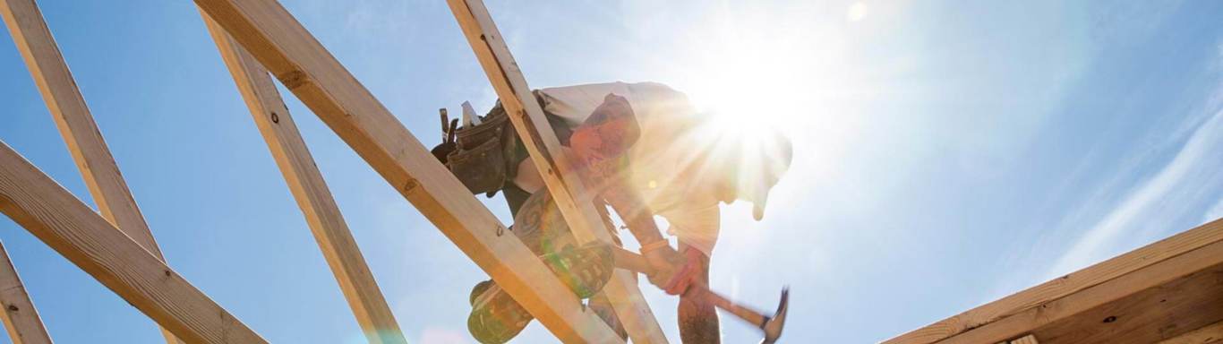 Construction Worker Framing A Building