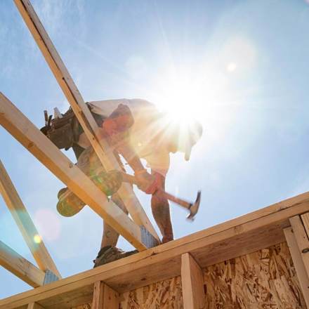 Construction Worker Framing A Building