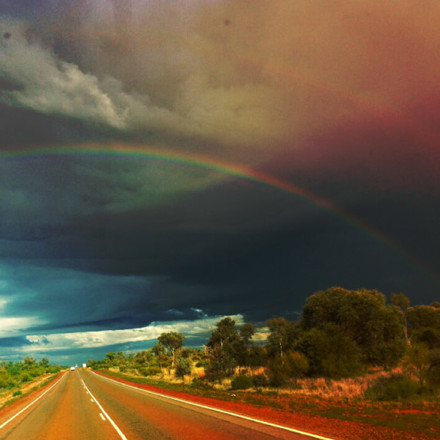 Double rainbow on an open rural road