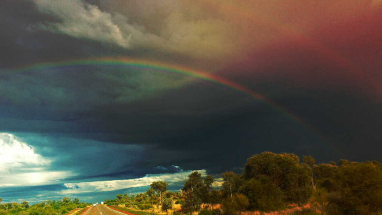 Double rainbow on an open rural road