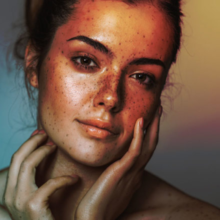 Beautiful young girl with freckle. Studio shot