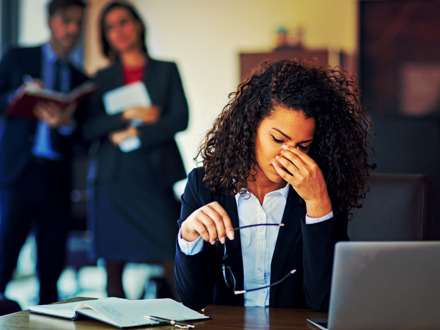 Burnout businesswoman under pressure in the office