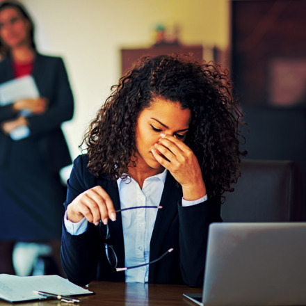 Burnout businesswoman under pressure in the office