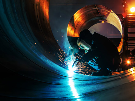 The welder is welding steel plates