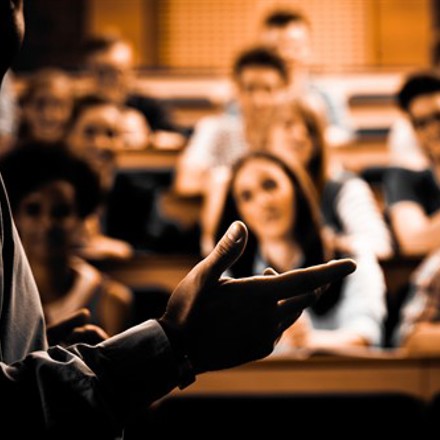 Lecturer teaching a class. 