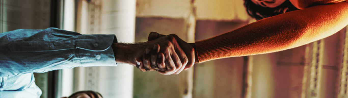 Two people shaking hands.