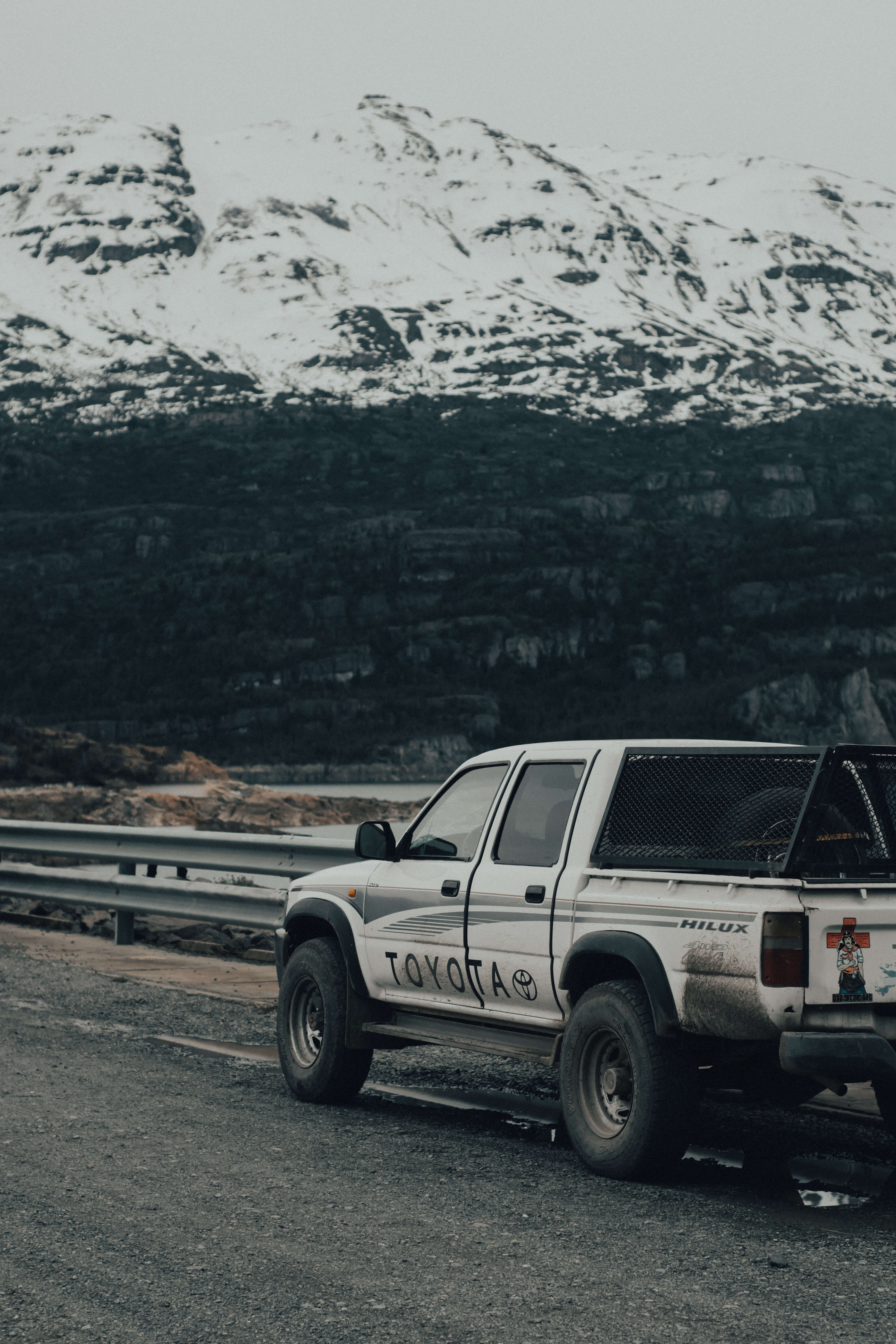 Toyota ute against a snowy mountain. 