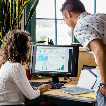 Microsoft Partner showing a staff member the Microsoft Platform. 