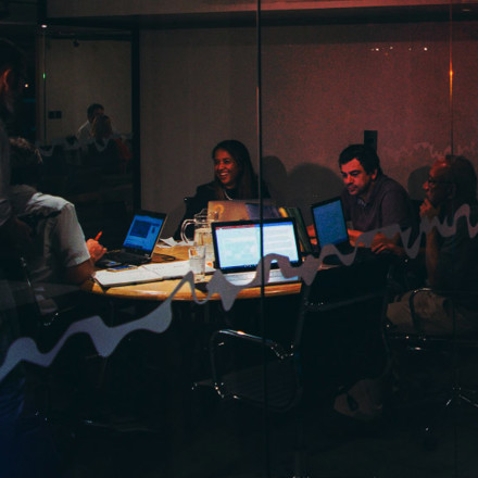 A group of people starting a business, working late into the night. 