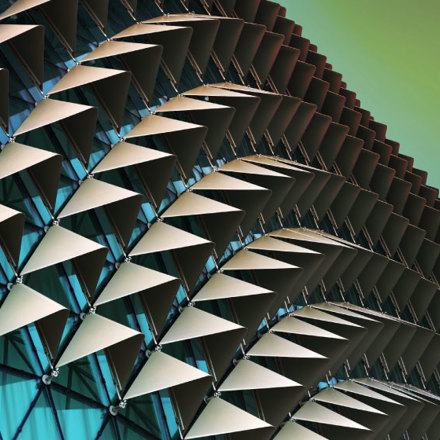 Abstract close-up view of modern aluminium ventilated facade of triangles.