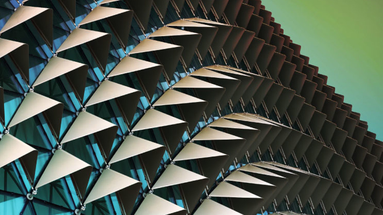 Abstract close-up view of modern aluminium ventilated facade of triangles.