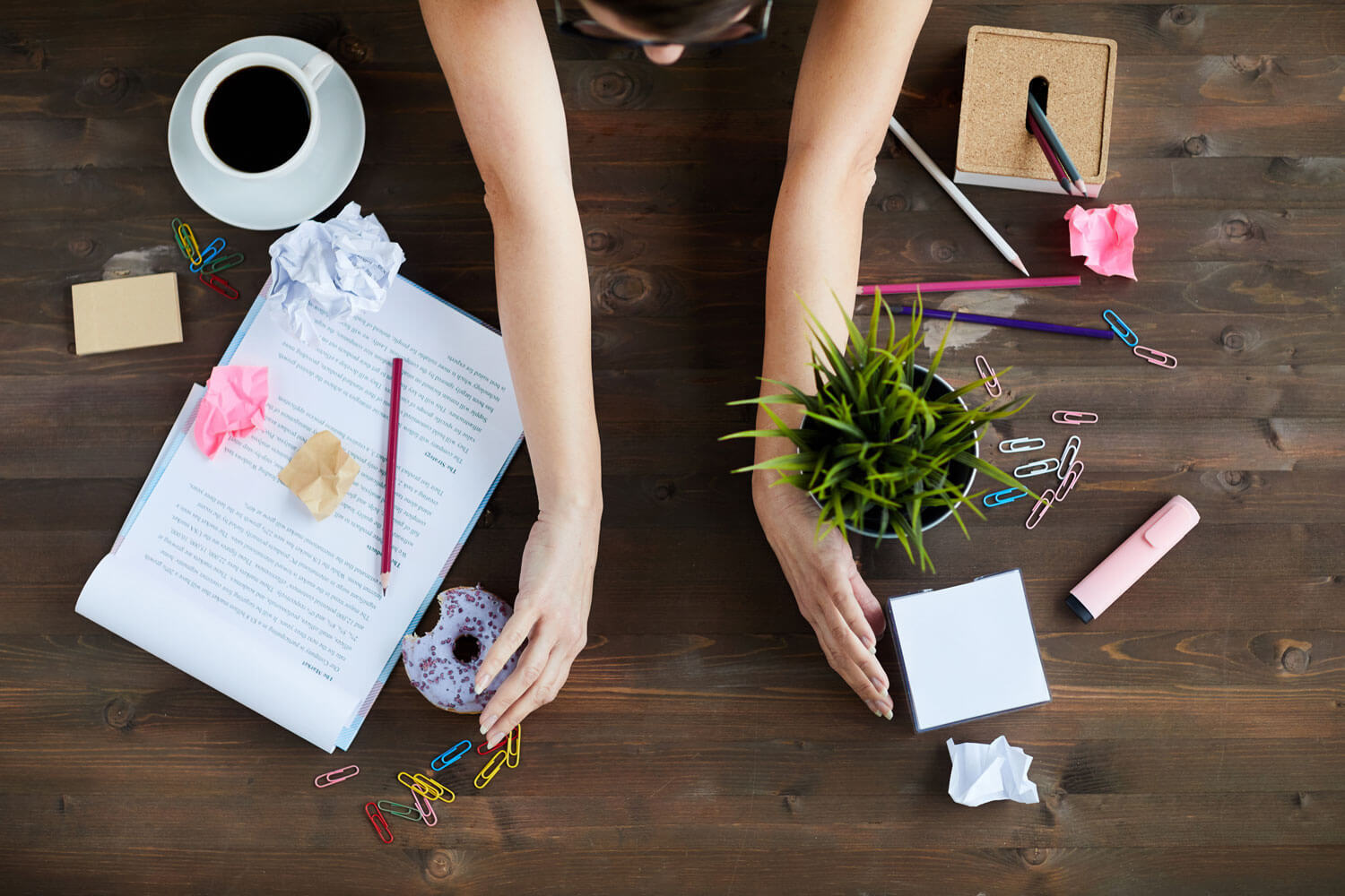 Woman Tidying Up Office Desk.