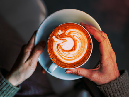 Flat Lay Woman Hand Holding Coffee Latte