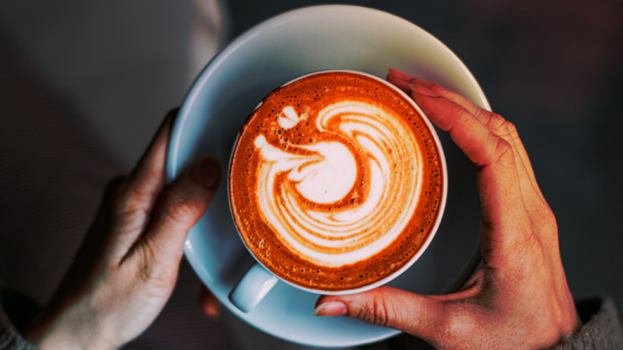 Flat Lay Woman Hand Holding Coffee Latte