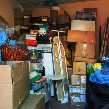 filled garage with boxes and household items