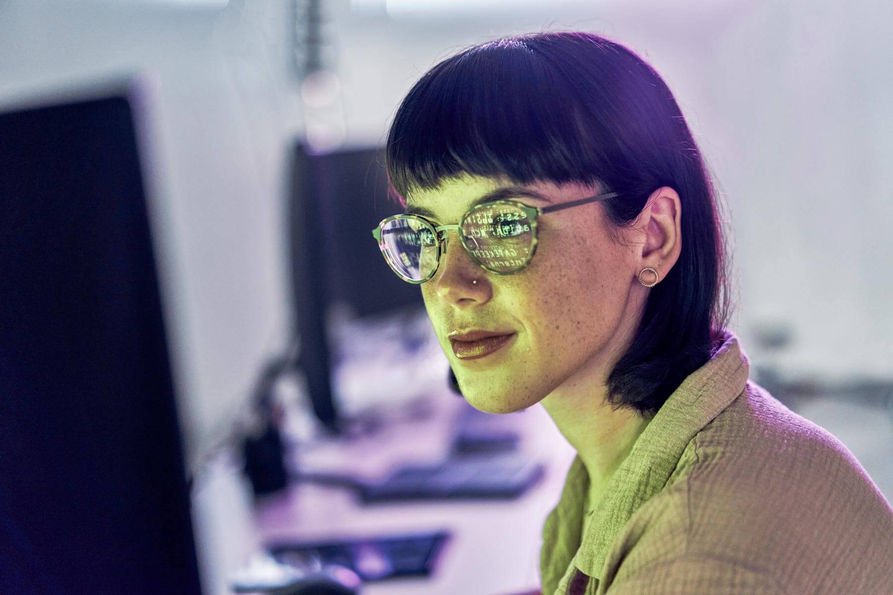 Night, reflection and neon with woman at computer for programmer, cloud computing and software developer. Coding, cybersecurity and technology with employee in digital agency for it, designer or code.