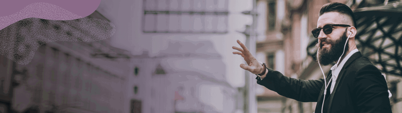 Man hailing a taxi while wearing earphones.