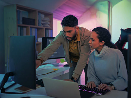 Programmer, computer and software coding team work on database, website or cloud computing algorithm code. Developer, partnership and collaboration of black woman and man on cybersecurity programming