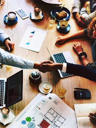 Top view of a business meeting around a table.