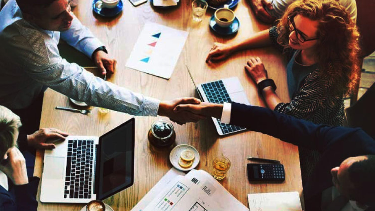 Top view of a business meeting around a table.